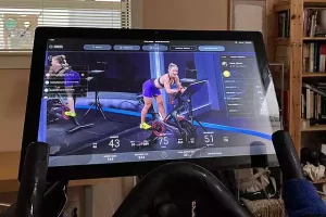 Peloton screen with a female instructor