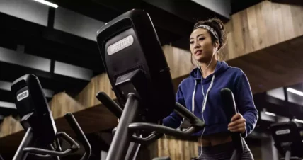 Woman using Precor equipment
