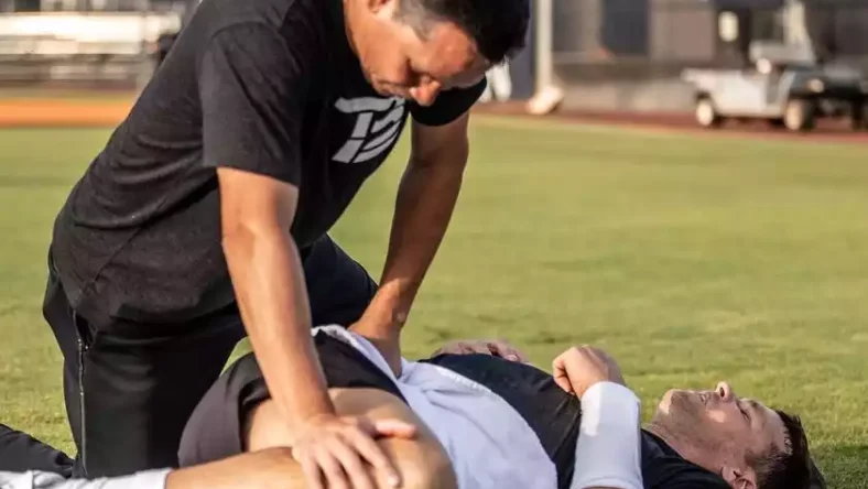Tom Brady and Alex Guerrero training