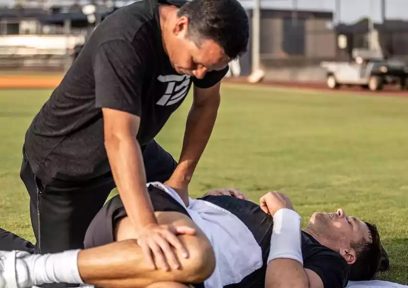 Tom Brady and Alex Guerrero training