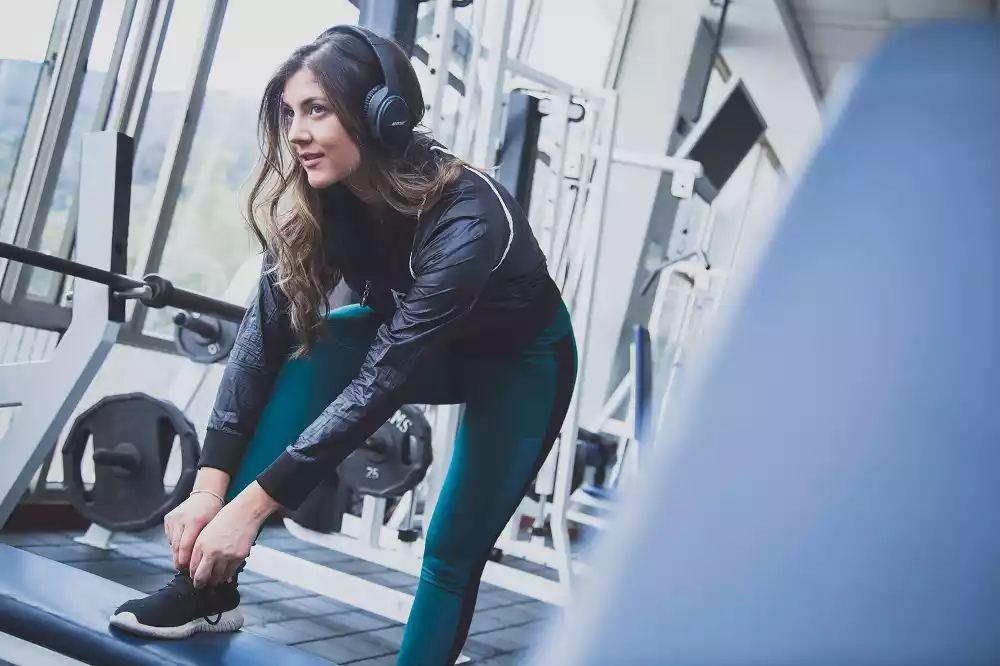 Girl listening music while getting ready to exercise