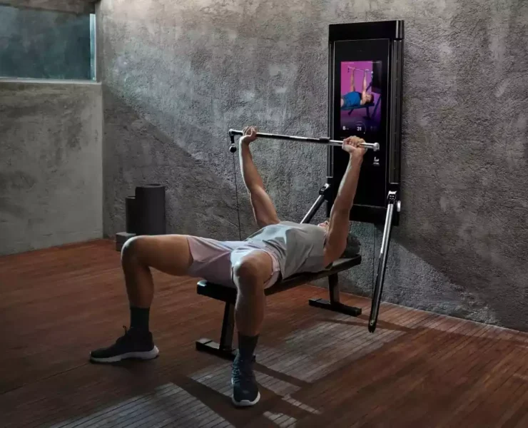 Man using Tonal smart home gym
