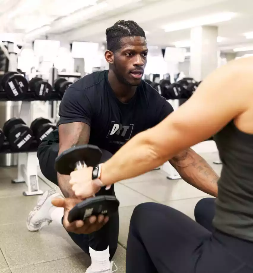 Man in gym with trainer