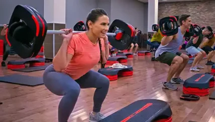 Woman working out at a 24 Hour Fitness gym