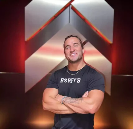 Erick Wilson smiling with his hands folded