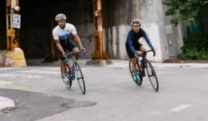 Two cyclists bicycling