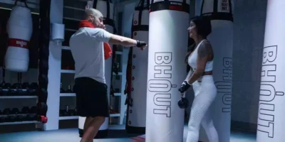 Man punching BHOUT, the boxing bag Jake Paul and Mike Tyson will compete with.