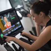 Woman using connected fitness equipment
