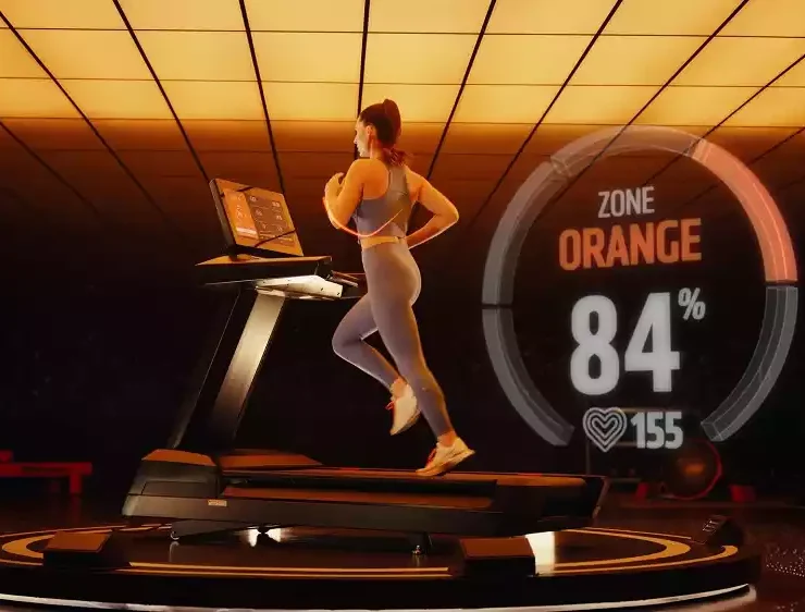 Woman running on a treadmill at Orangetheory Fitness