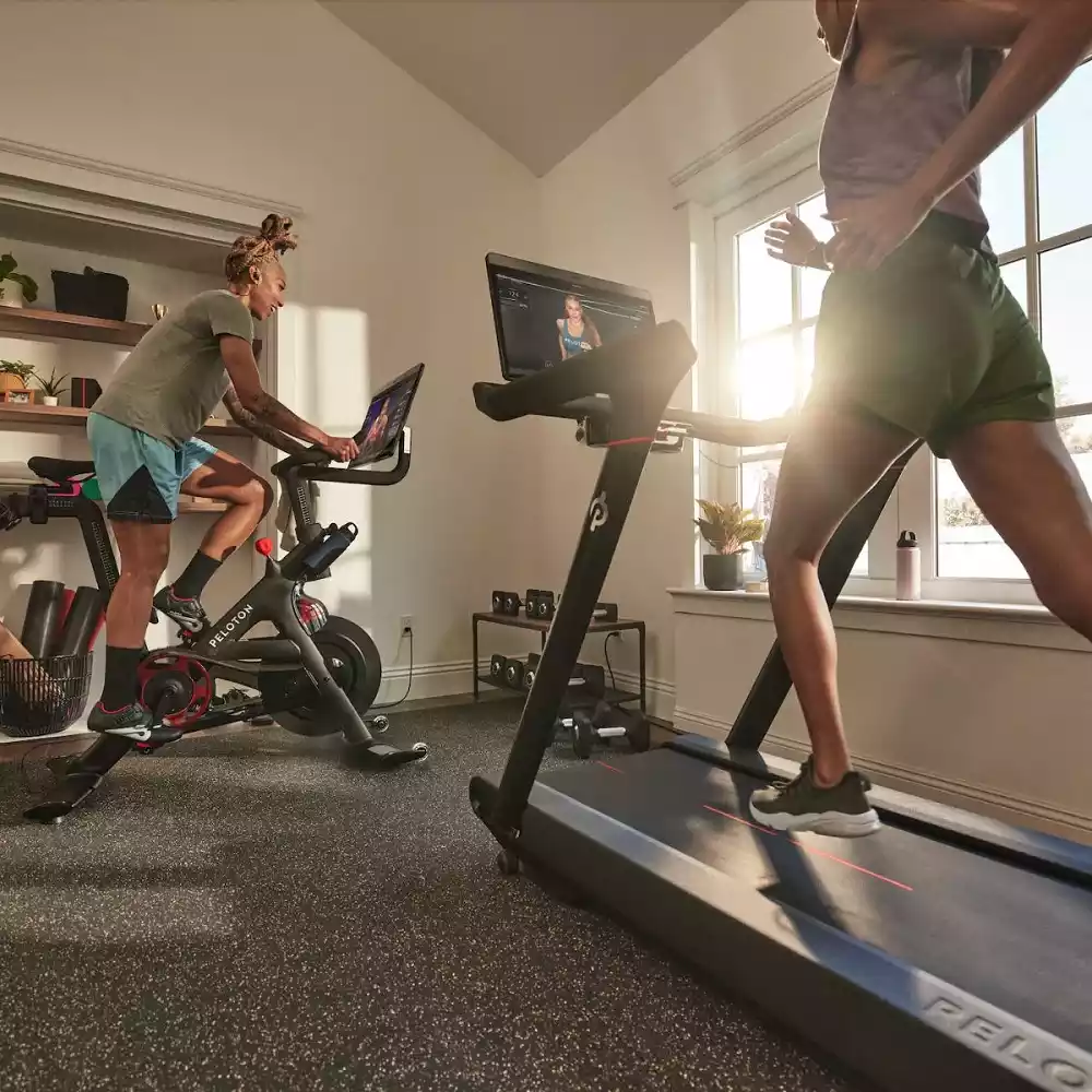 People working on Peloton equipment