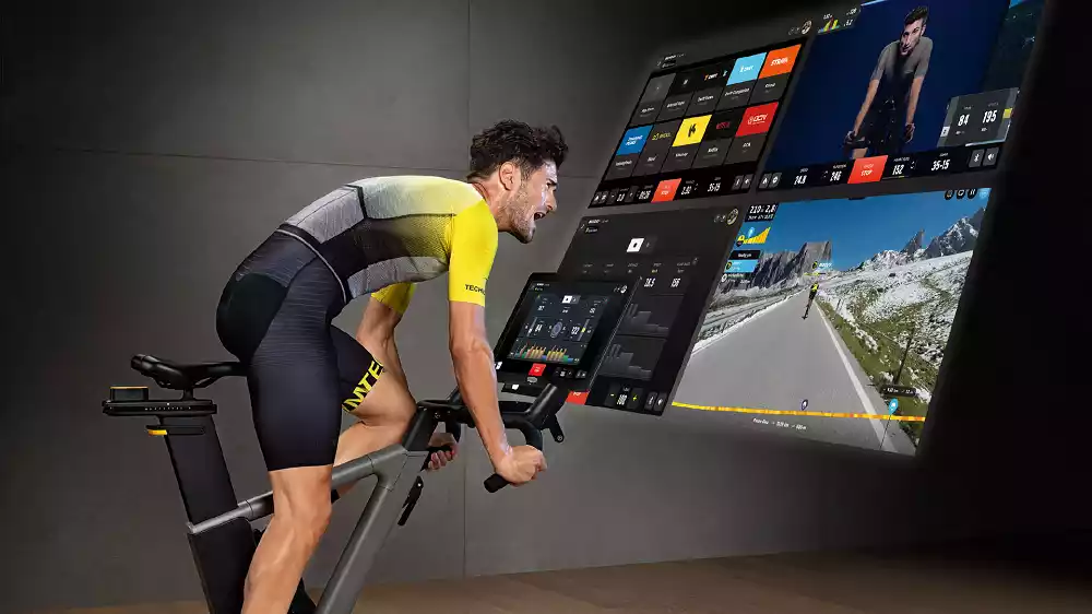 Man using Technogym smart bike Ride