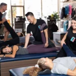an image of clients receiving assisted stretches from StretchLab