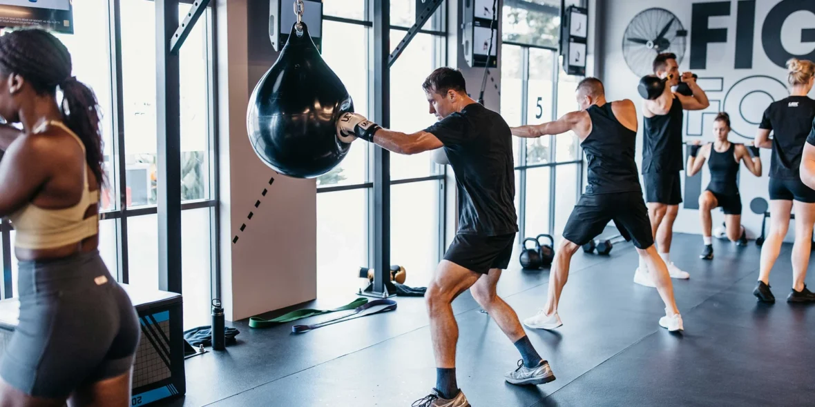 UBX boxing interior, member swinging at bags