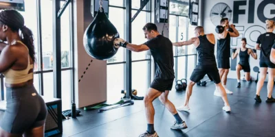 UBX boxing interior, member swinging at bags