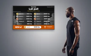 man looks at a digital fitness leaderboard