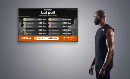 man looks at a digital fitness leaderboard