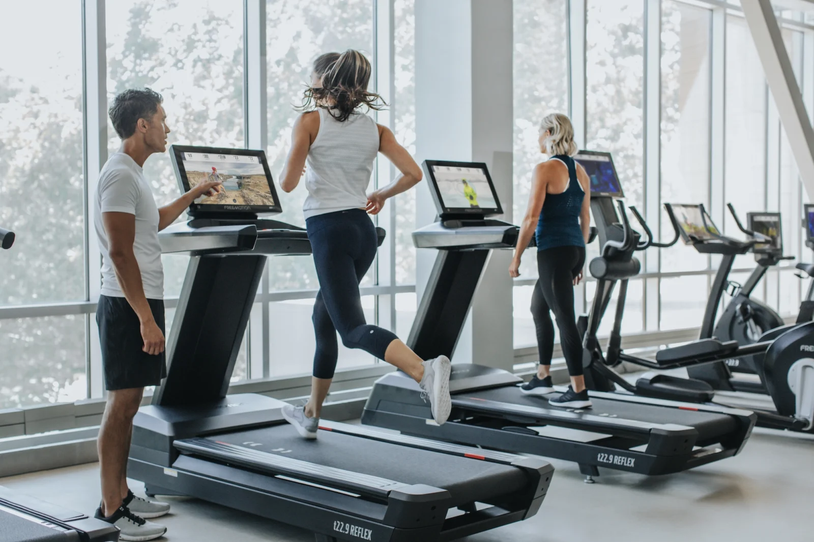 People on treadmills at gym