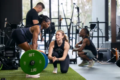 woman deadlifts at a BFT studio