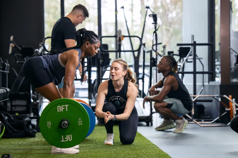 woman deadlifts at a BFT studio