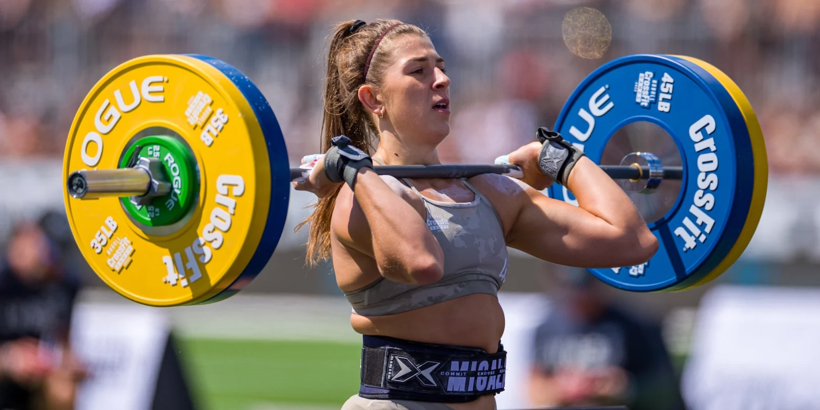 CrossFit female trainer with barbell