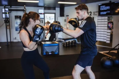 man and woman spar at a UBX studio