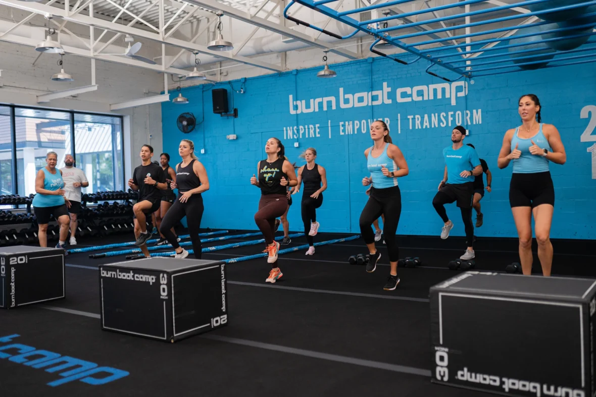 people work out inside a Burn Boot Camp