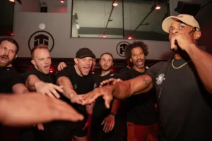 Tone House members celebrate during class