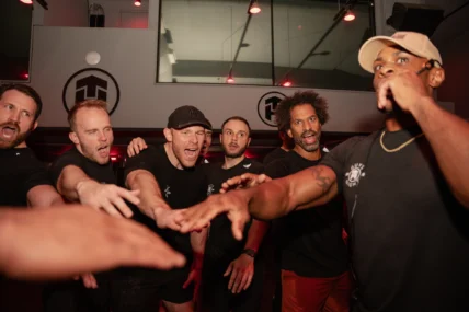 Tone House members celebrate during class