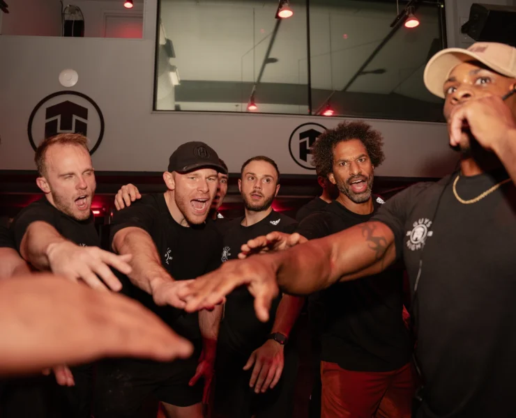 Tone House members celebrate during class
