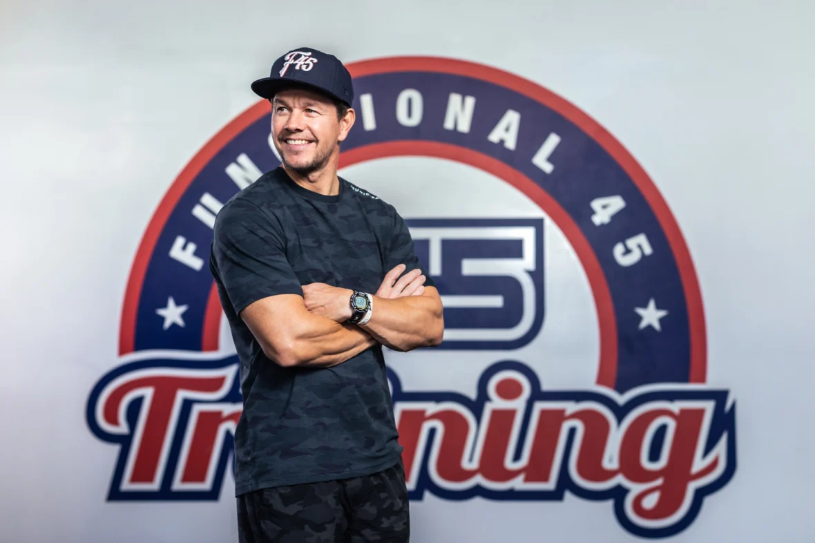 an image of Mark Walhberg in front of the F45 logo