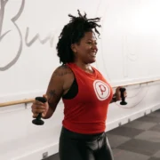 woman works out at a Pure Barre studio