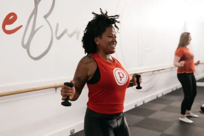 woman works out at a Pure Barre studio