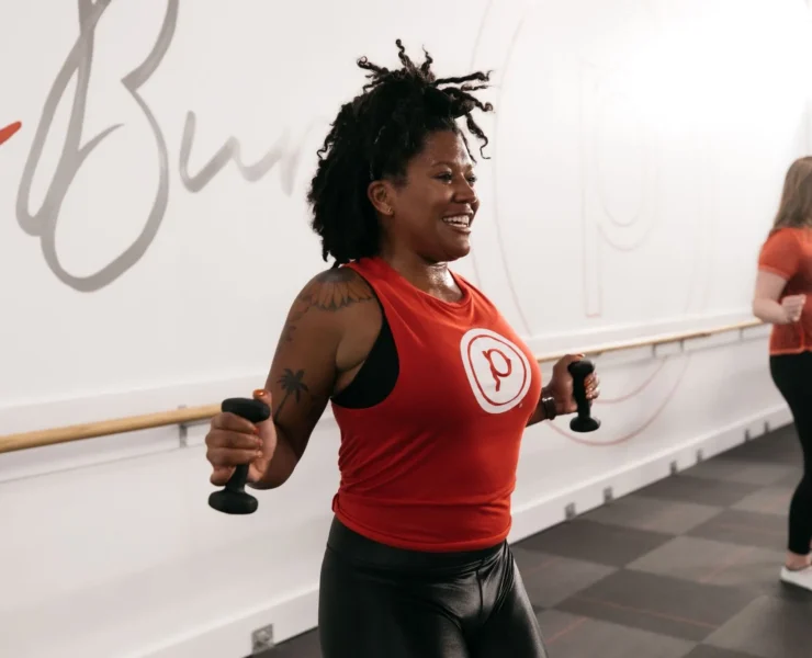 woman works out at a Pure Barre studio