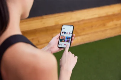 woman uses the ClassPass app on her smartphone