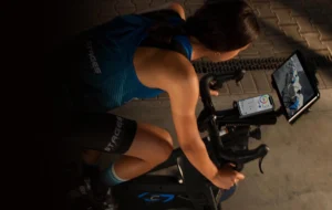 an image of a woman riding an indoor bike