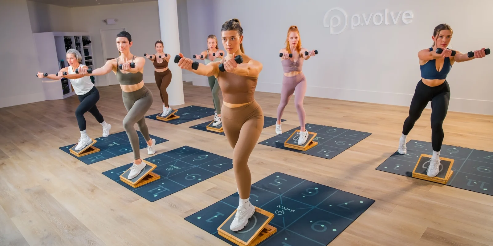 woman work out on mats at Pvolve studio