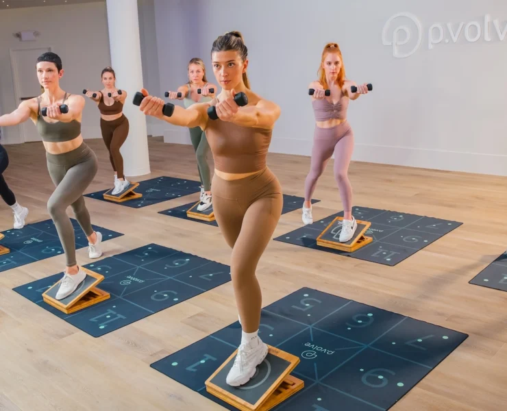 woman work out on mats at Pvolve studio