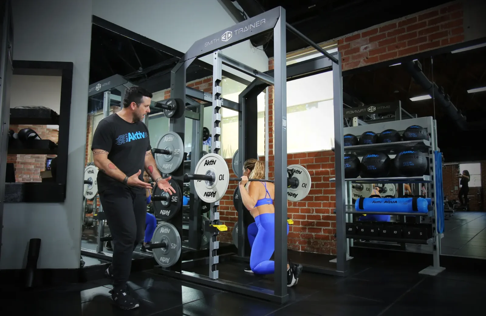 woman works out in a smith machine from Akitv Solutions