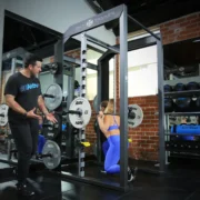 woman works out in a smith machine from Akitv Solutions