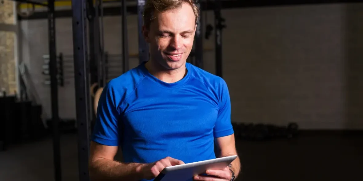 a man looking at a tablet