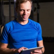 a man looking at a tablet