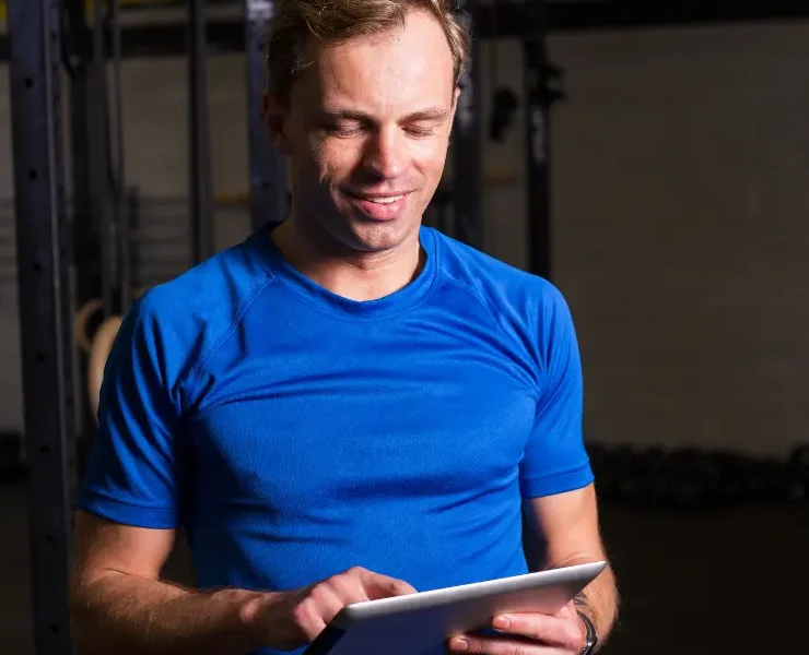 a man looking at a tablet