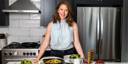 a smiling image of Dr. Casey Means in a kitchen