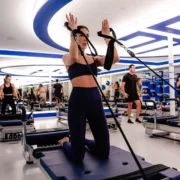 an image of a woman working out on a JetSet Pilates reformer