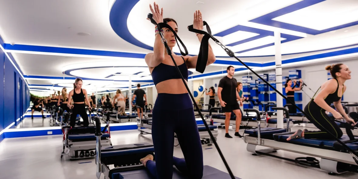 an image of a woman working out on a JetSet Pilates reformer