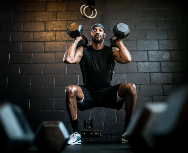 man performs strength training workout at MADabolic gym