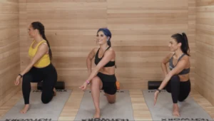 Women doing yoga in sauna