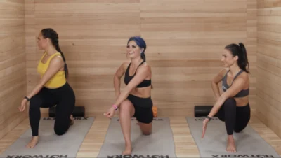 Women doing yoga in sauna