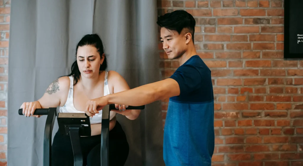 PT with woman on bike