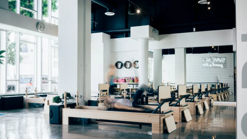 Woman on a Pilates reformer in a studio